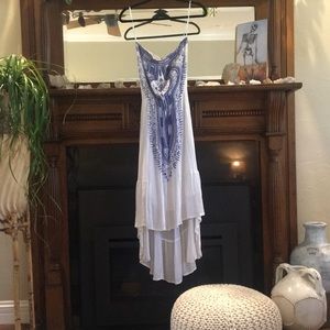 Asymmetrical white maxi dress.